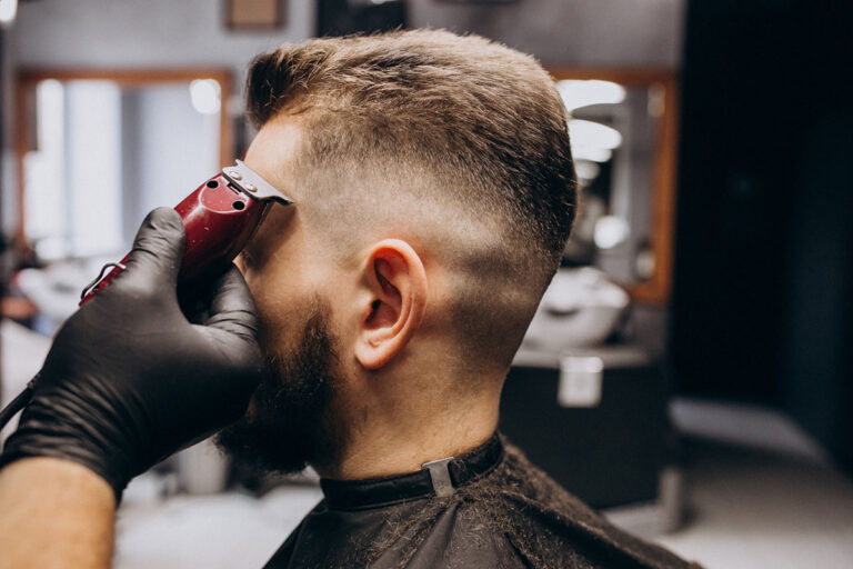 Man getting a crisp, clean haircut at the barber shop.